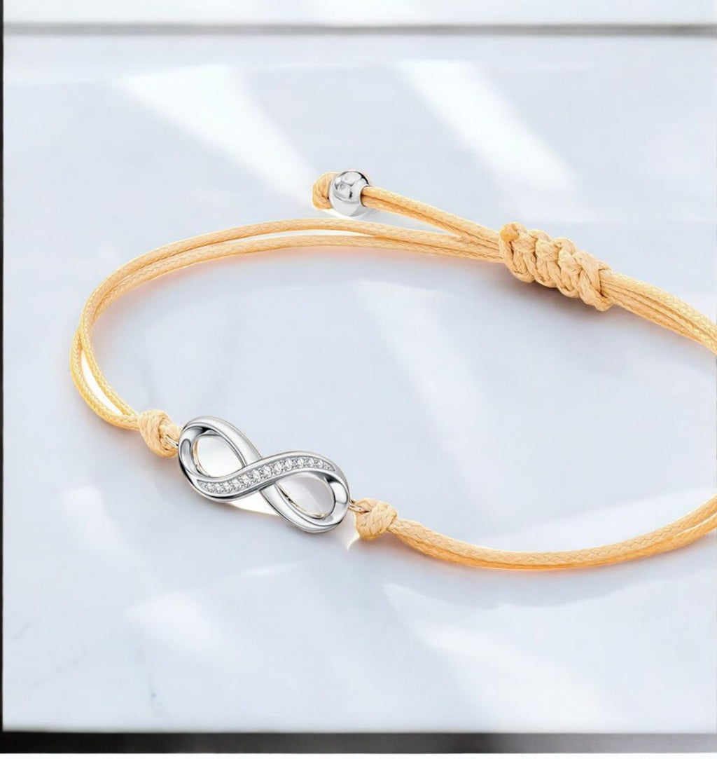 Bracelet "INFINITO" cordon beige adaptable Symbole Inifini argenté